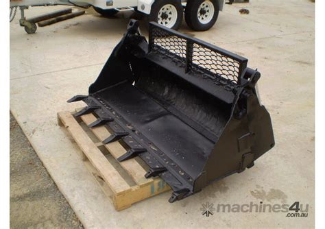 bobcat skid steer 4 in 1 bucket holding limbs|skidsteer 4 in one bucket.